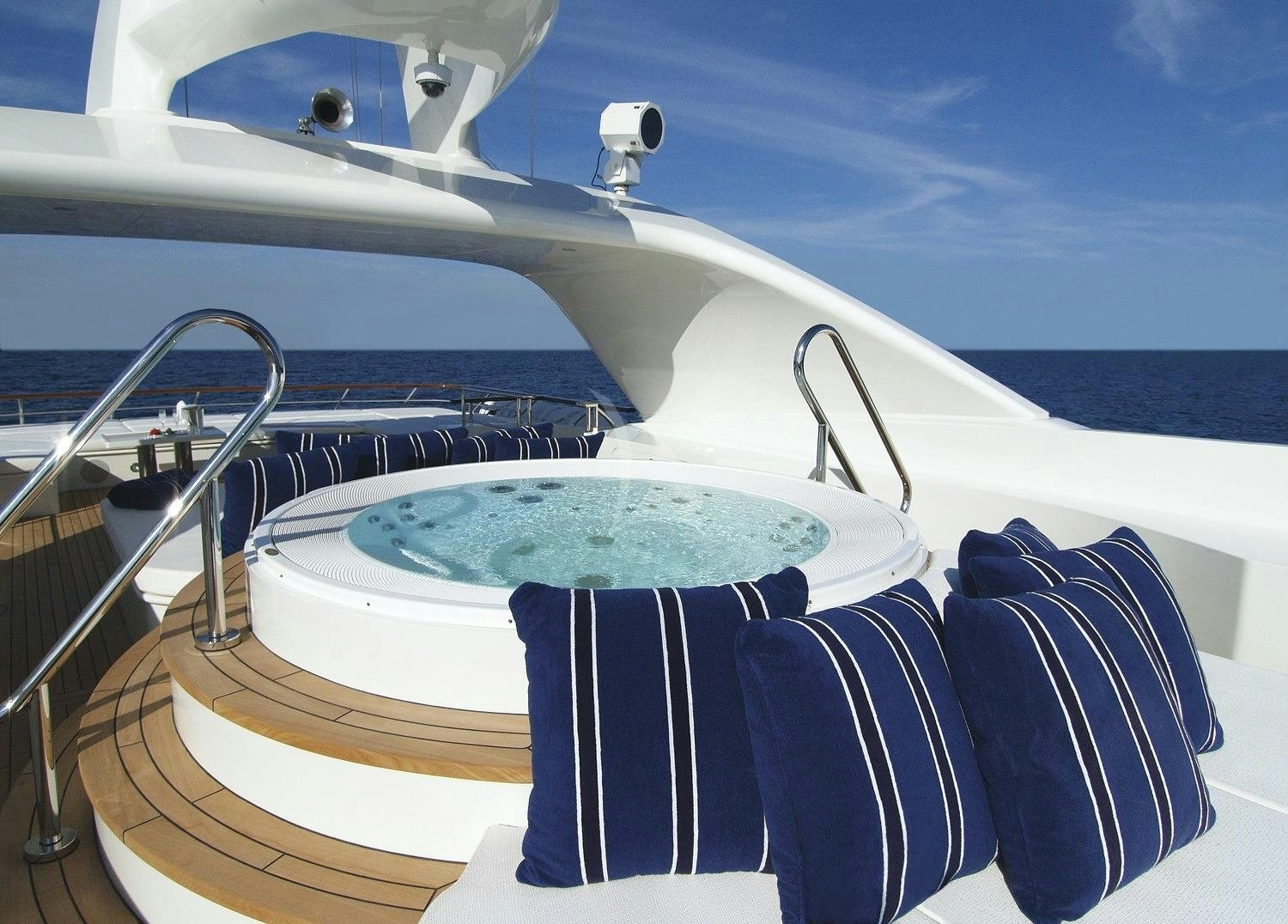 a boat with a blue and white striped cloth on the front aboard LADY DEE Yacht for Charter