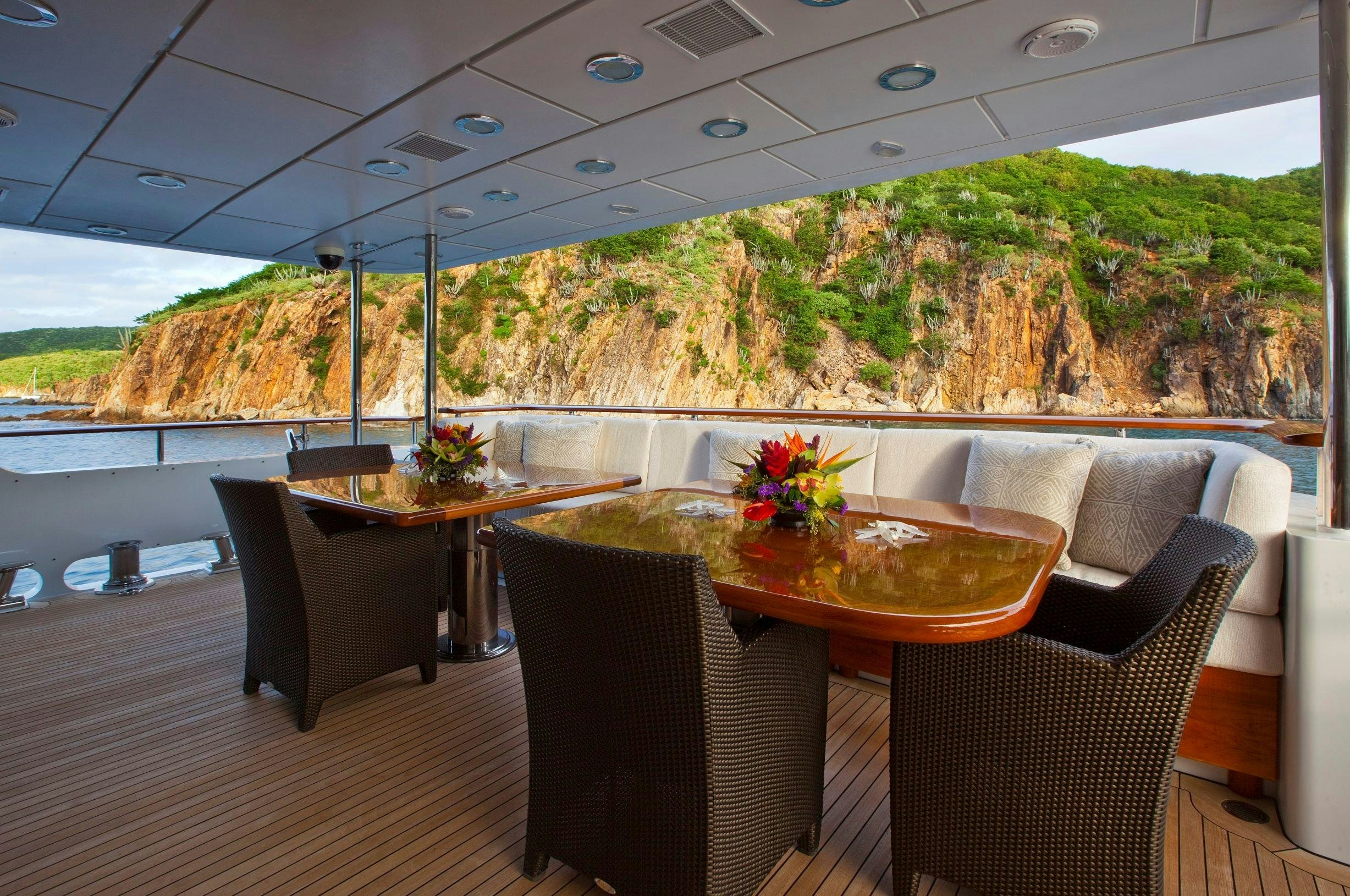 a room with a table and chairs aboard LEVERAGE Yacht for Charter