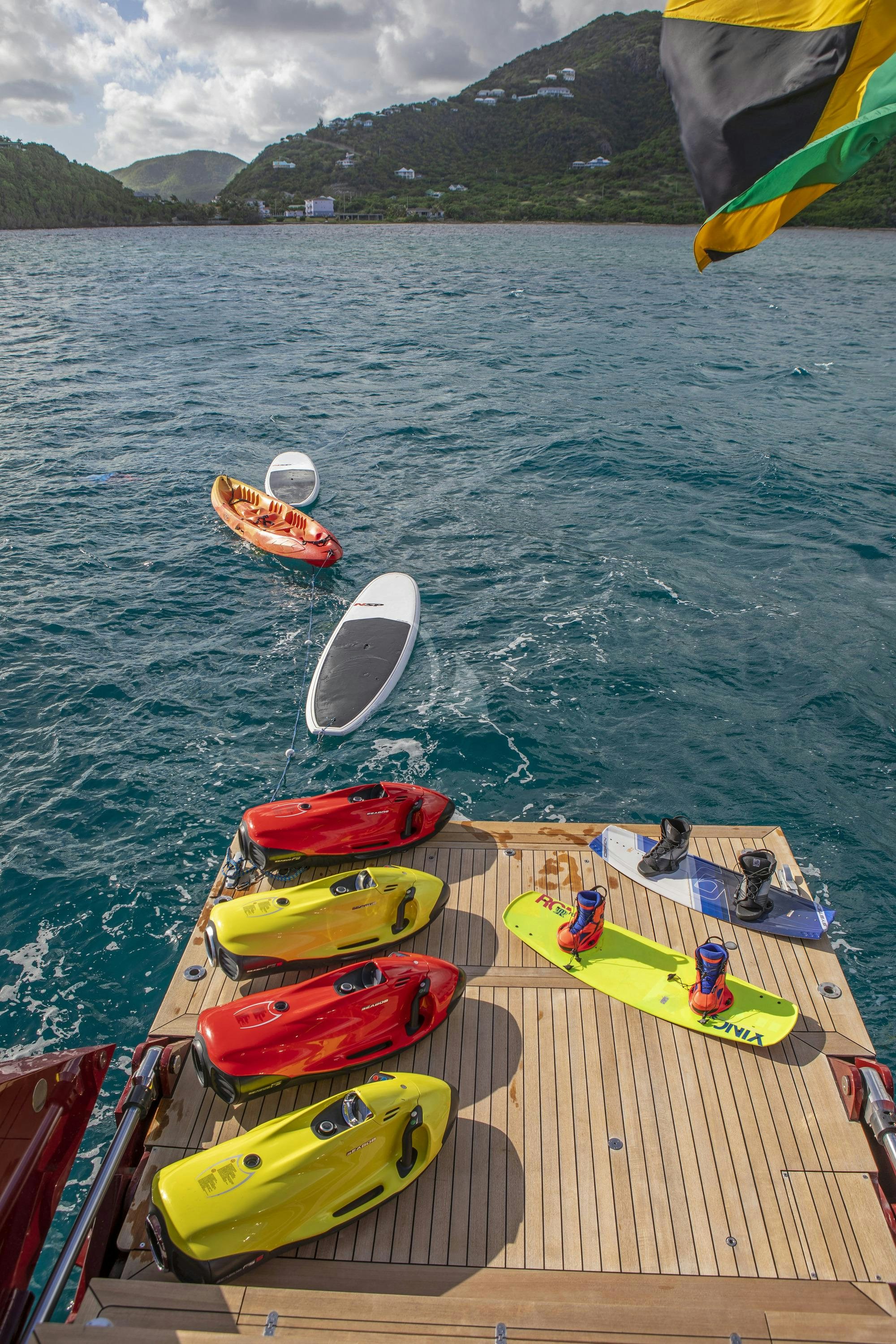 a group of people on a dock with boats on the water aboard MARE NOSTRUM Yacht for Charter