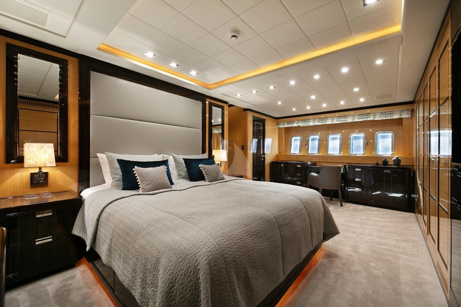 a large bedroom with a large bed aboard BO Yacht for Charter