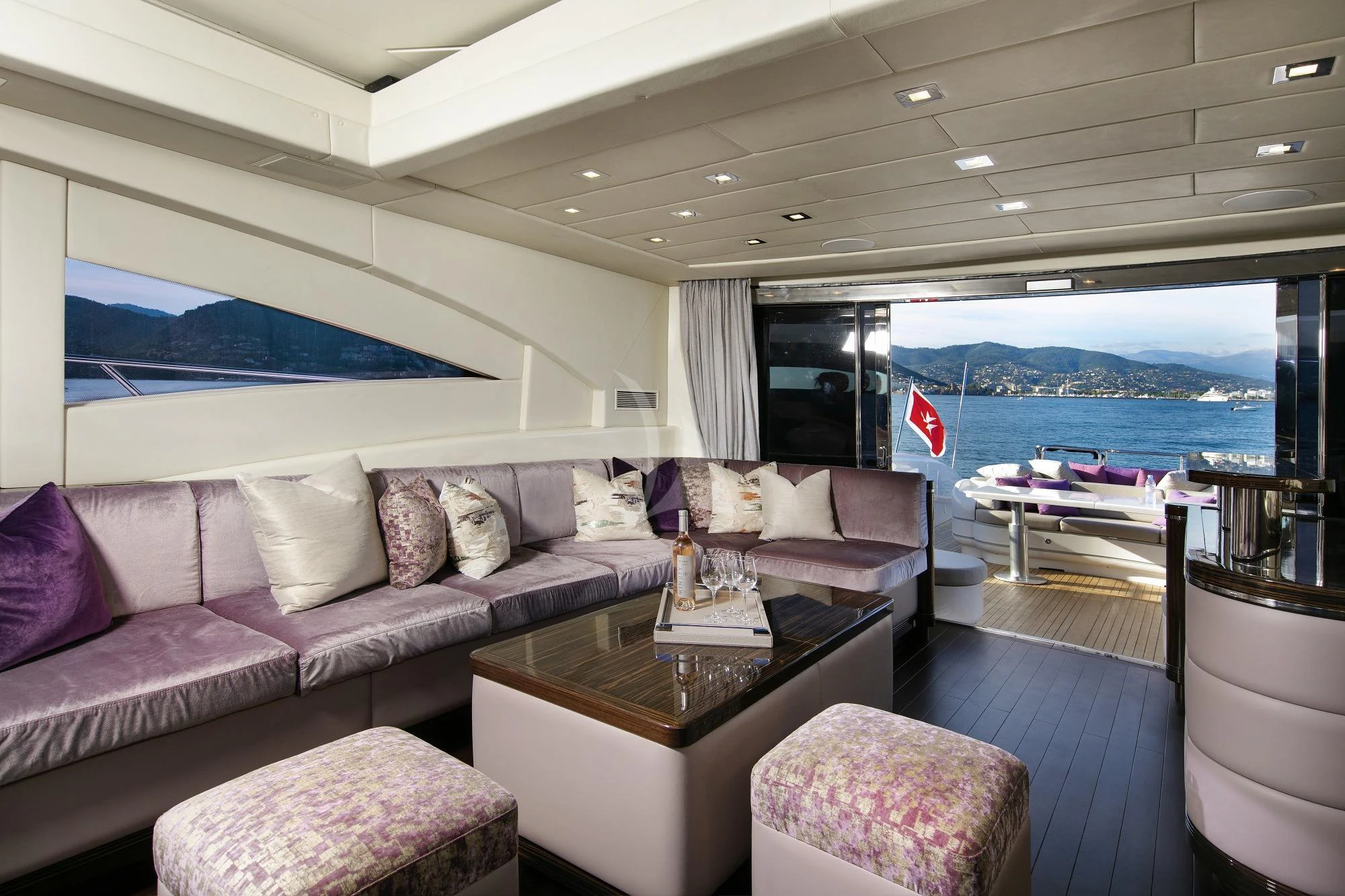a living room with a large window aboard BO Yacht for Charter