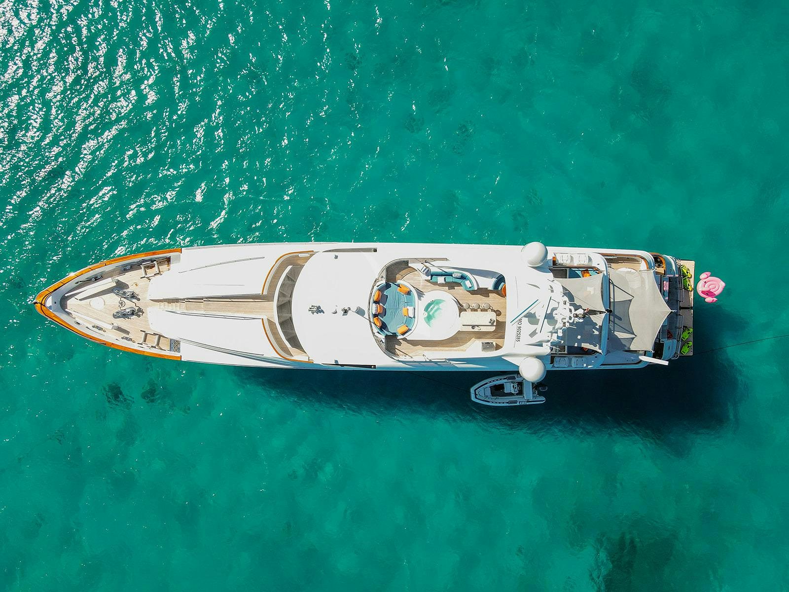 a model of a ship on a green surface aboard M3 Yacht for Charter