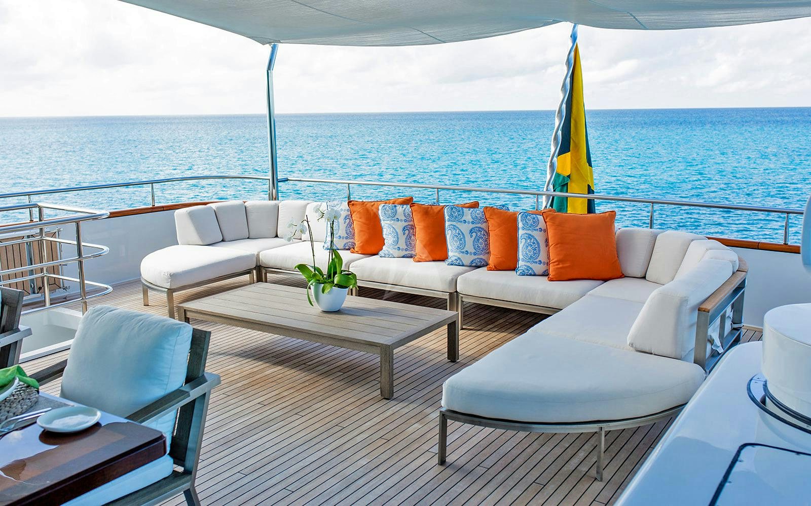 a patio with a table and chairs aboard M3 Yacht for Charter