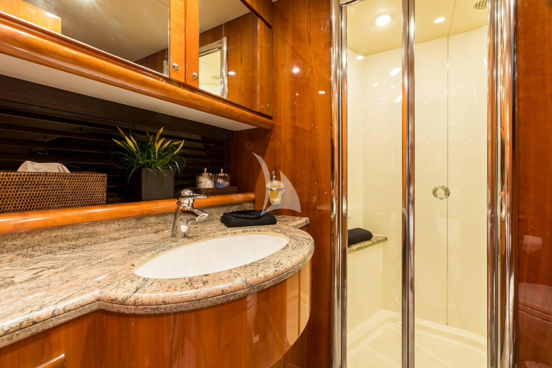 a bathroom with a sink and a shower aboard WINNING STREAK 2 Yacht for Charter