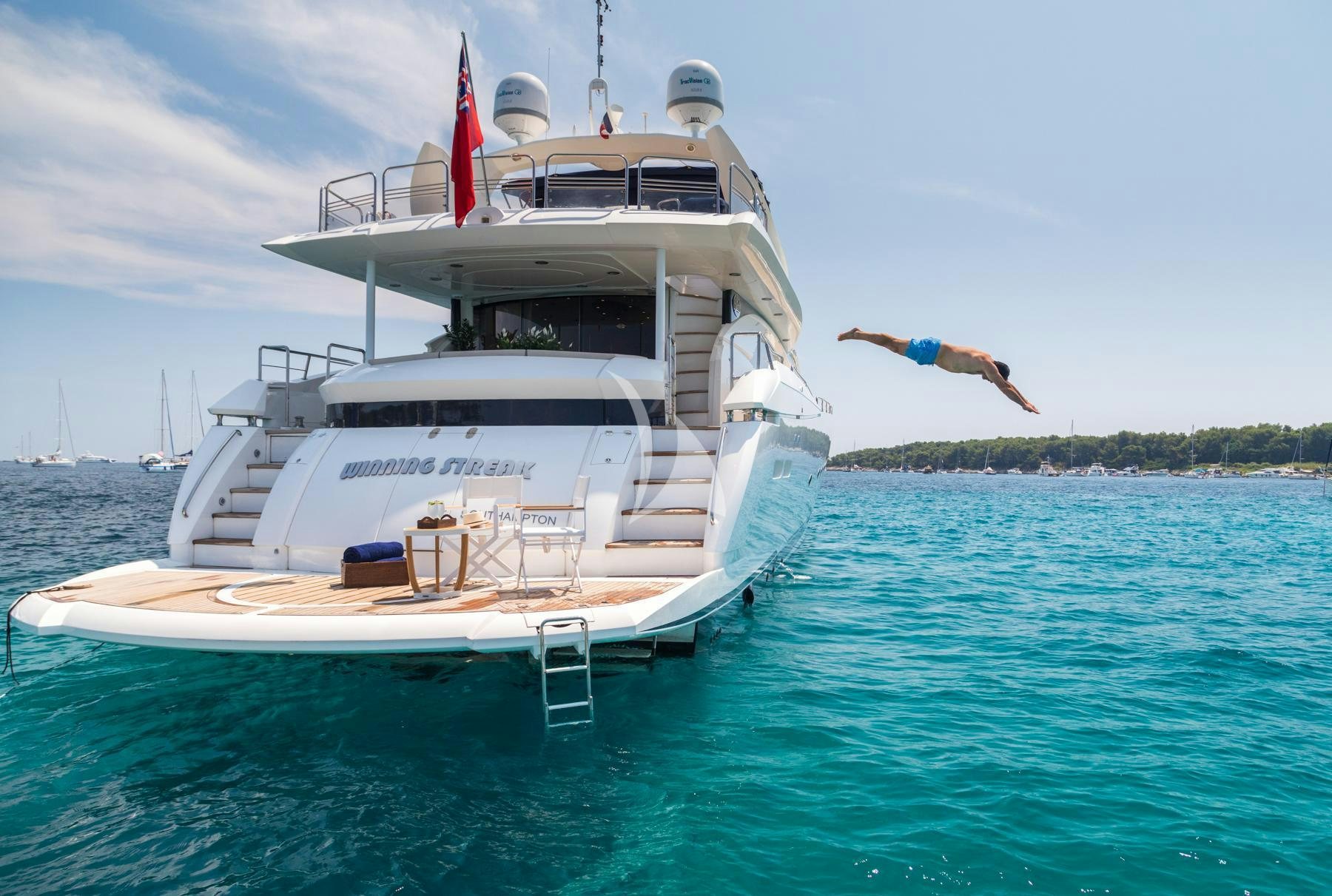 a person standing on a boat aboard WINNING STREAK 2 Yacht for Charter