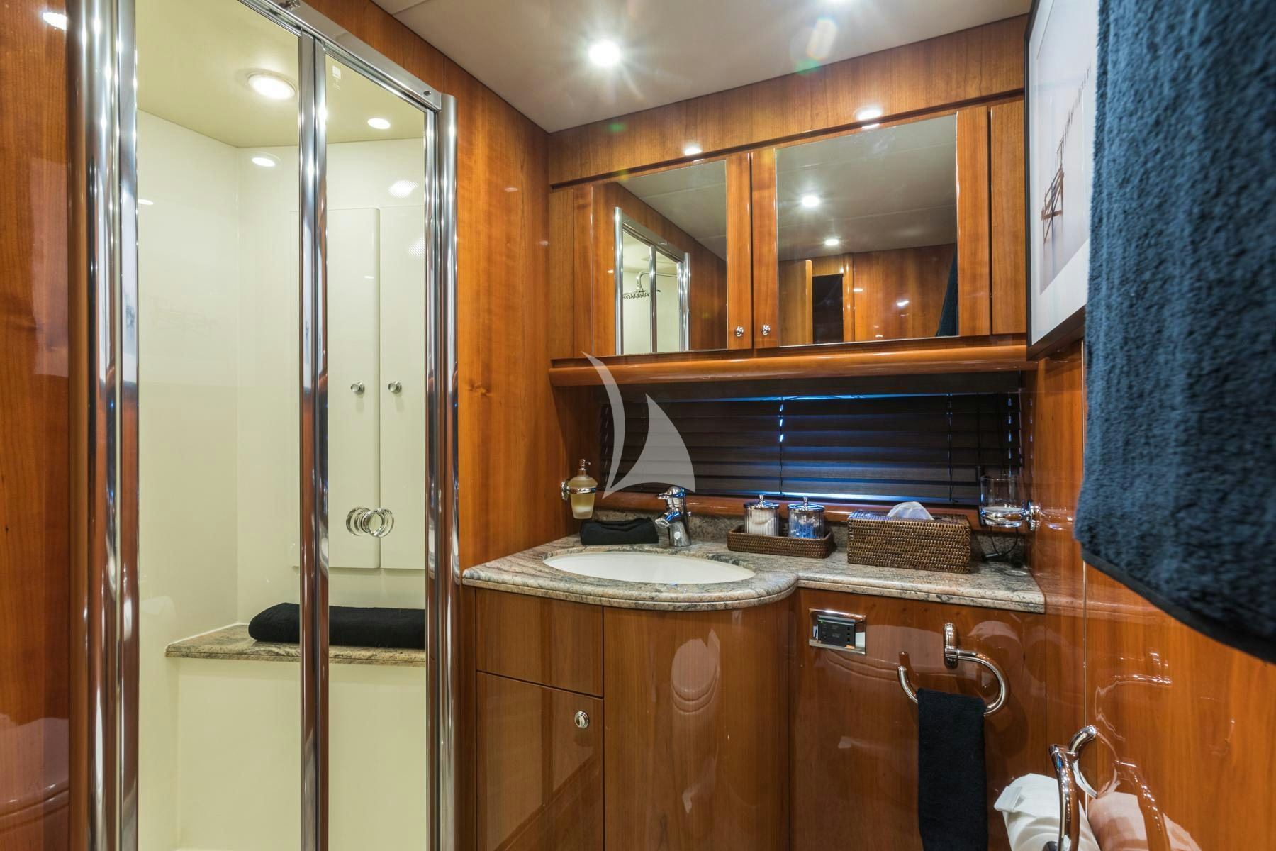a bathroom with a sink and cabinets aboard WINNING STREAK 2 Yacht for Charter