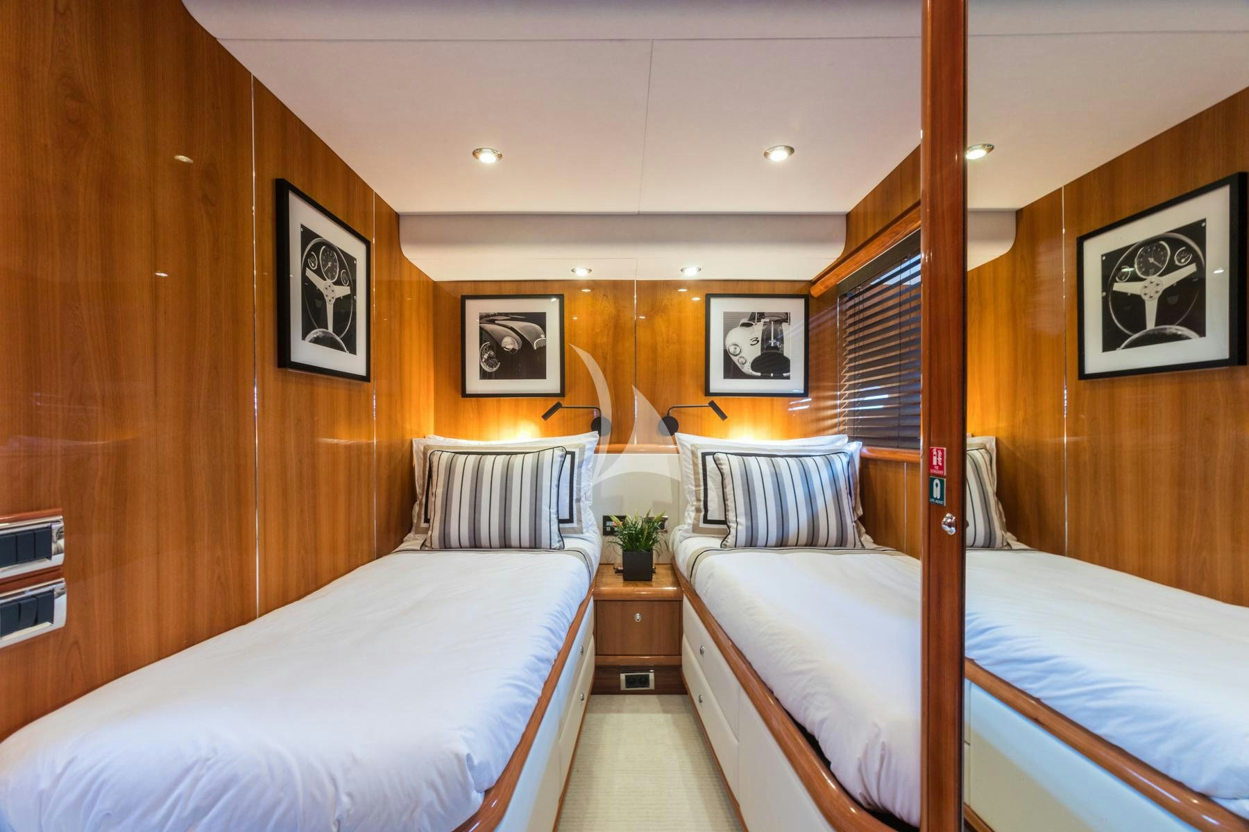 a room with wooden walls and a couple of beds aboard WINNING STREAK 2 Yacht for Charter