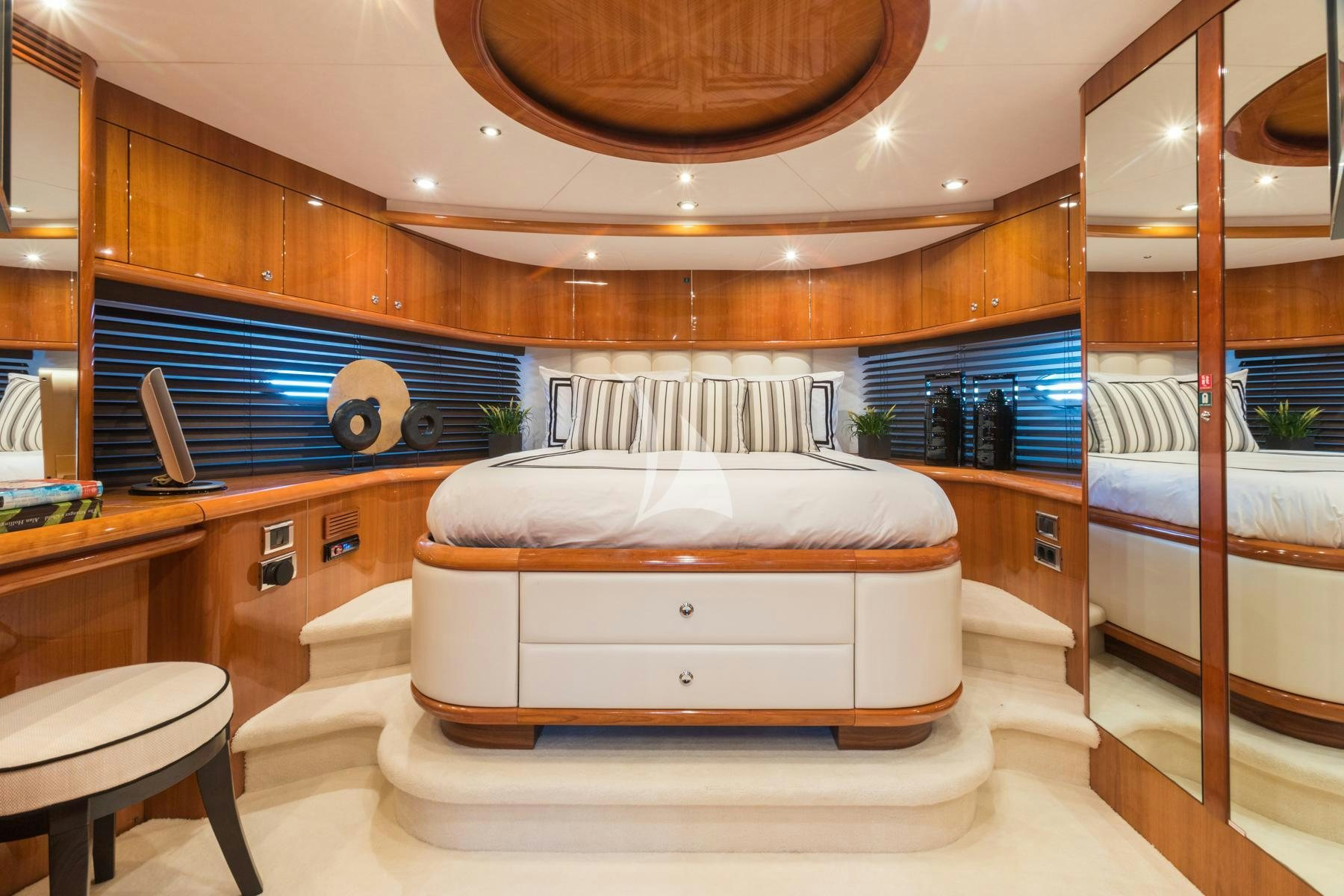 a room with a bed and a desk aboard WINNING STREAK 2 Yacht for Charter