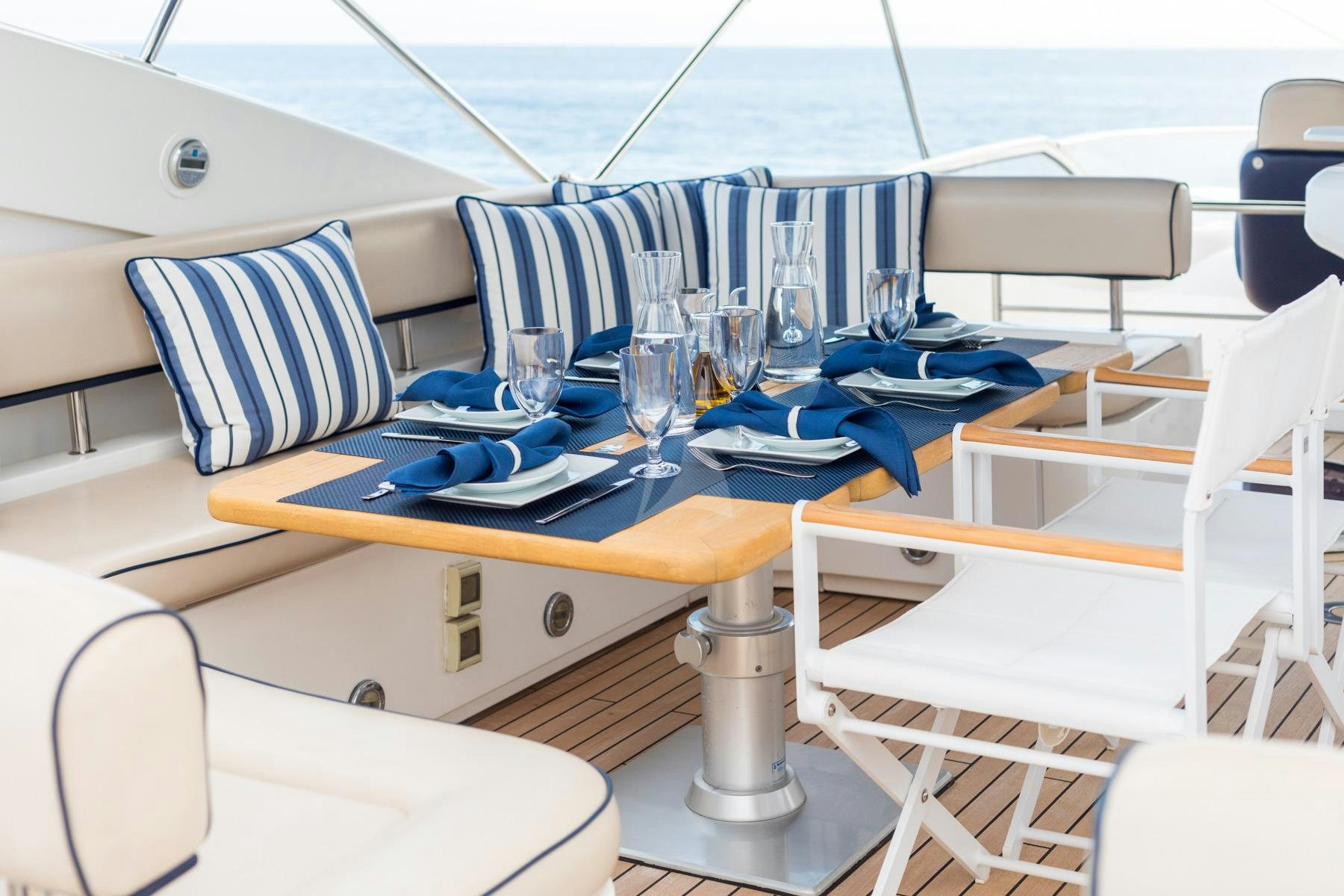 a table with chairs and a tray on it aboard WINNING STREAK 2 Yacht for Charter