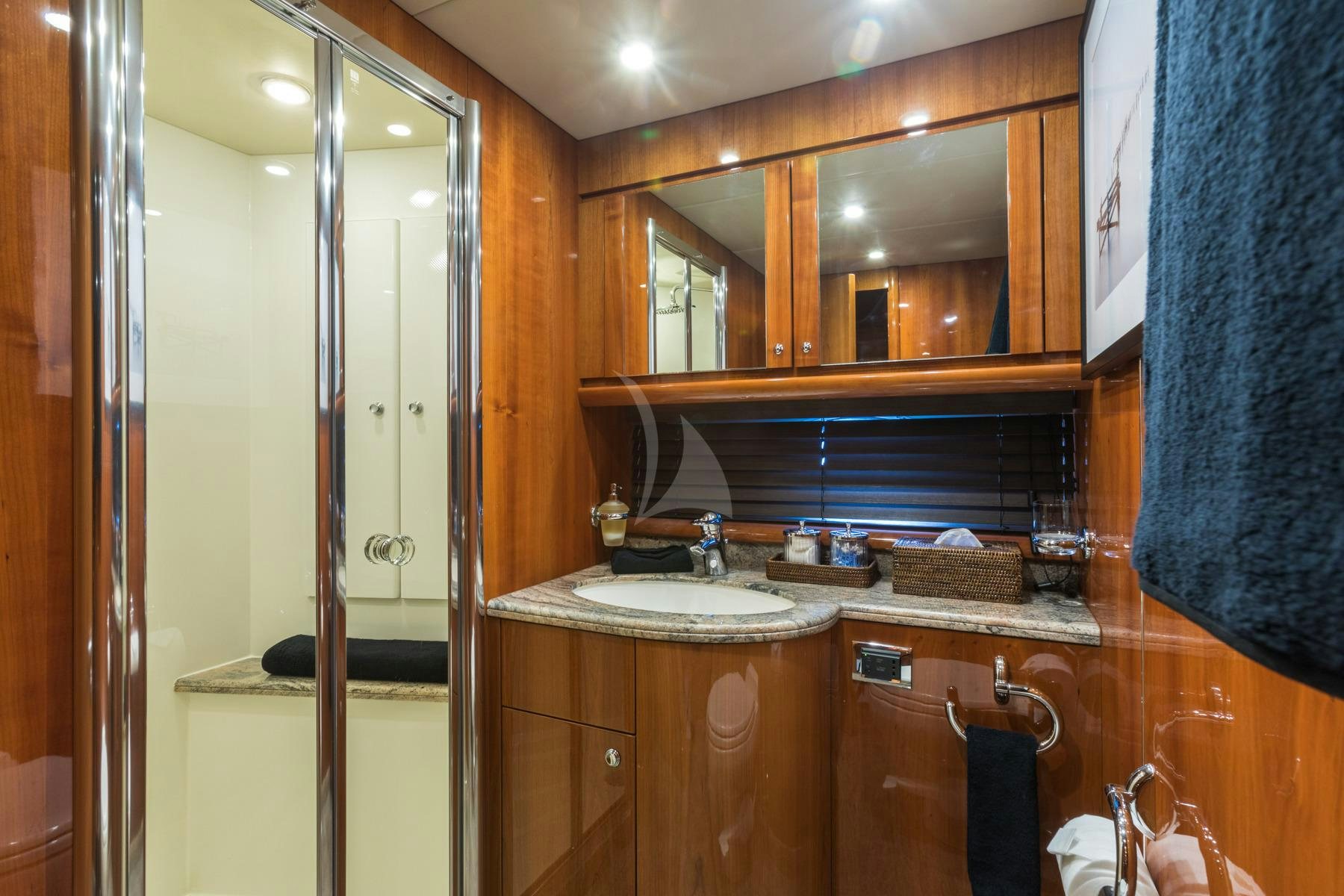 a bathroom with a sink and cabinets aboard WINNING STREAK 2 Yacht for Charter