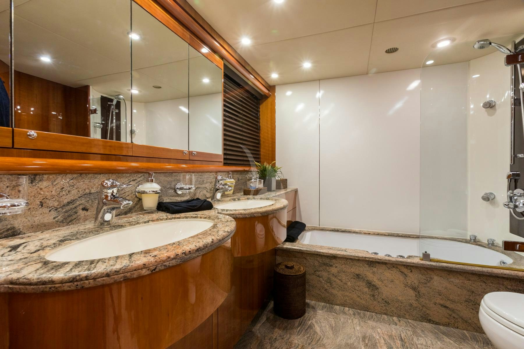 a bathroom with a large mirror aboard WINNING STREAK 2 Yacht for Charter