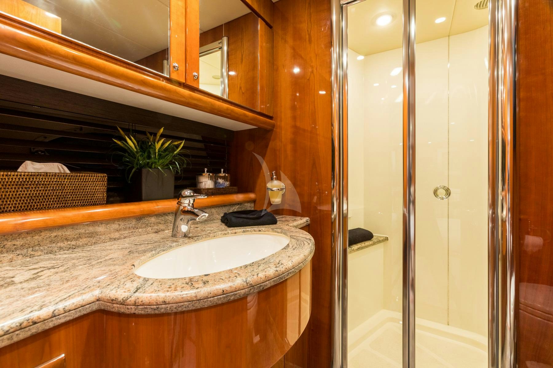 a bathroom with a sink and a shower aboard WINNING STREAK 2 Yacht for Charter