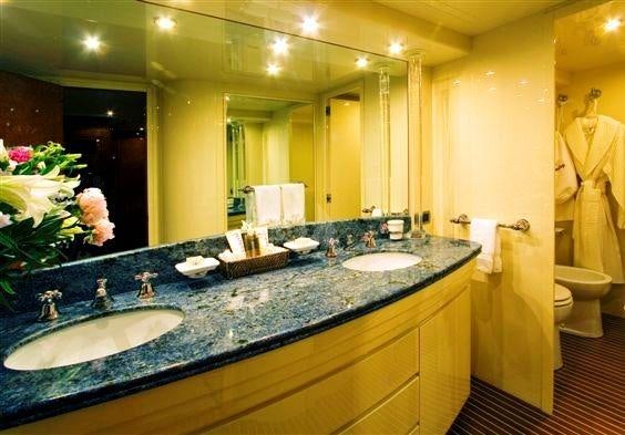 a bathroom with a large countertop aboard OBSESSION Yacht for Charter