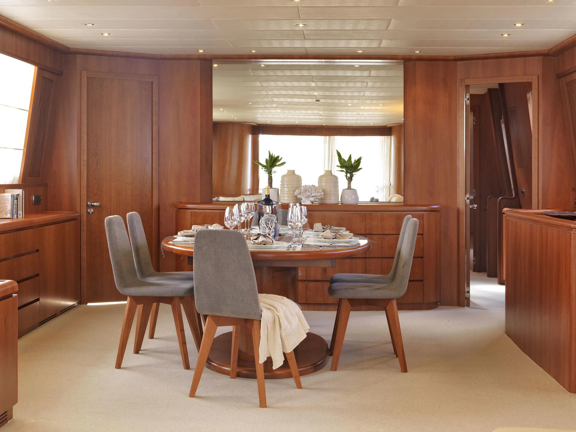 a dining room table and chairs aboard MARTINA Yacht for Charter