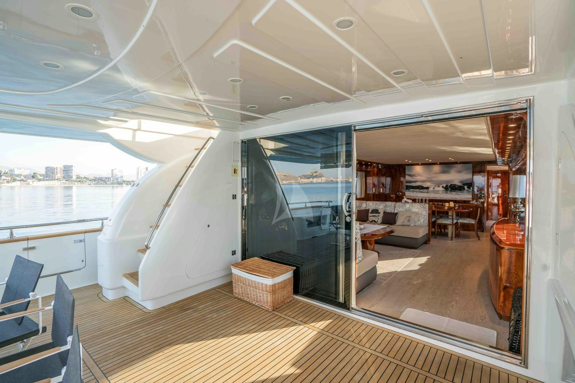 a room with a large window and a wood floor aboard KIAWAH II Yacht for Charter