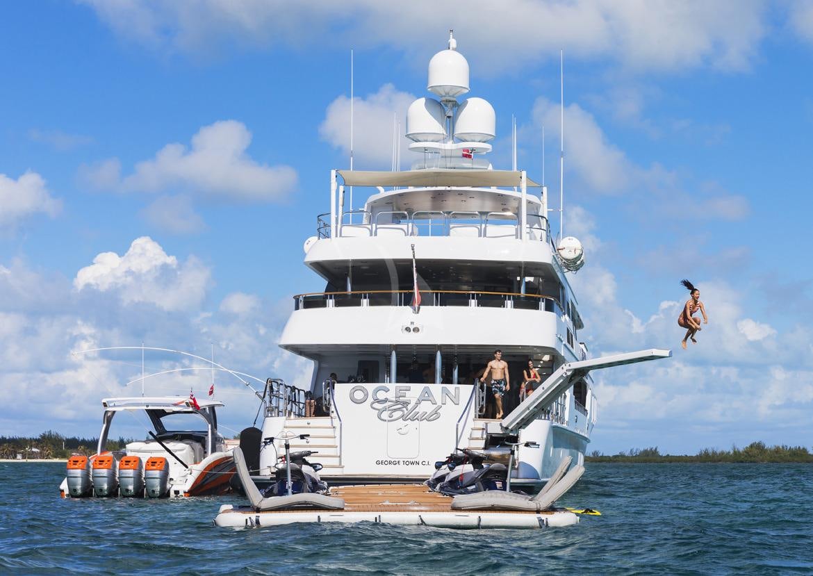 a boat with a person on it aboard OCEAN CLUB Yacht for Charter