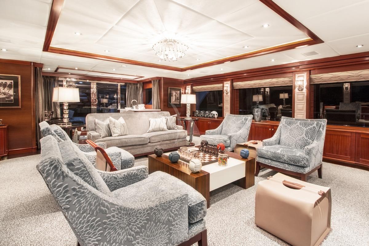 a living room with a couch and a coffee table aboard OCEAN CLUB Yacht for Charter