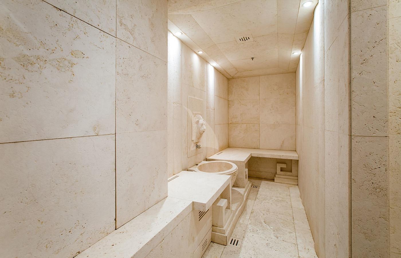 a bathroom with a toilet and a sink aboard LIONESS V Yacht for Charter