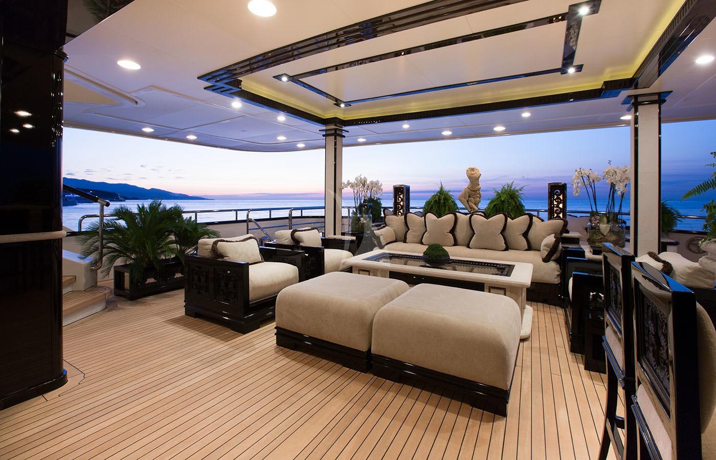 a living room with a large balcony aboard LIONESS V Yacht for Charter