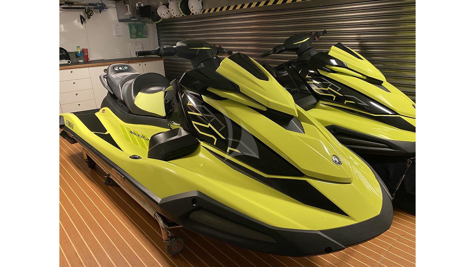 a yellow and black car aboard IMPROMPTU Yacht for Charter
