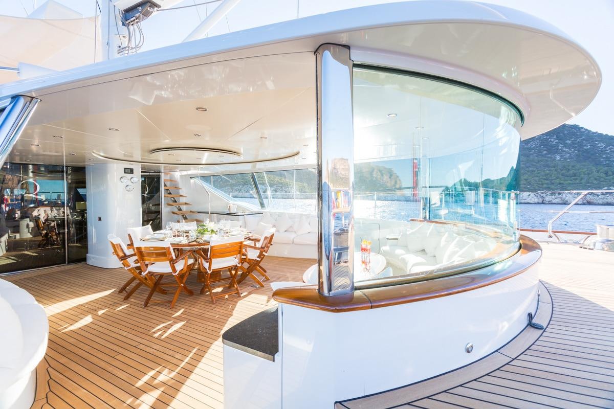 a large glass building with a large window aboard Q Yacht for Charter