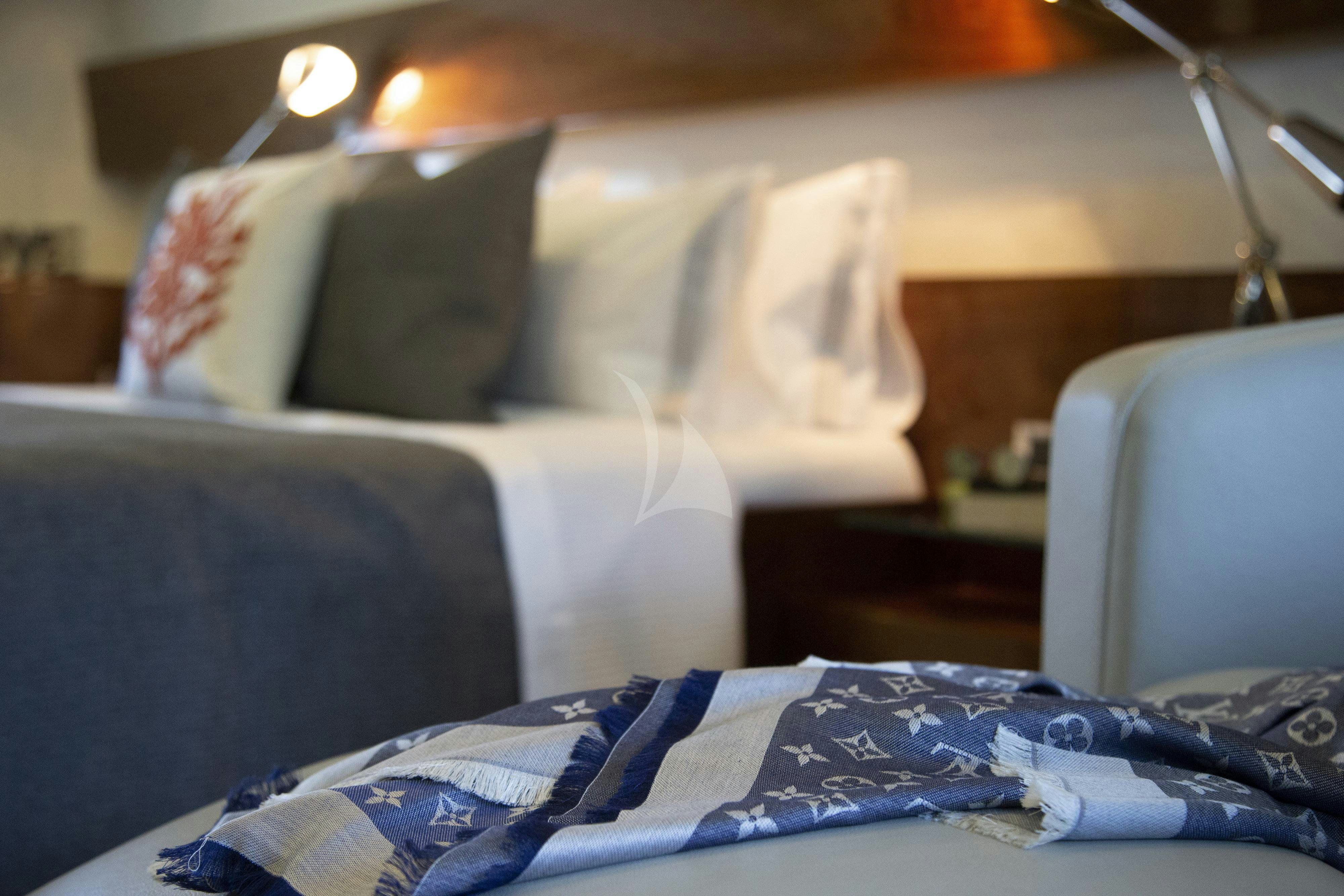 a couch with pillows aboard MUSIC Yacht for Charter