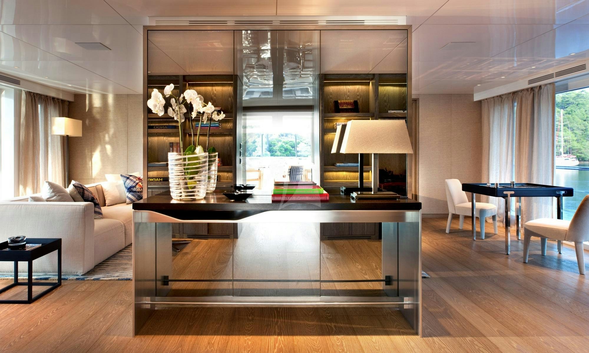 a living room with a large table aboard ORIENT STAR Yacht for Charter