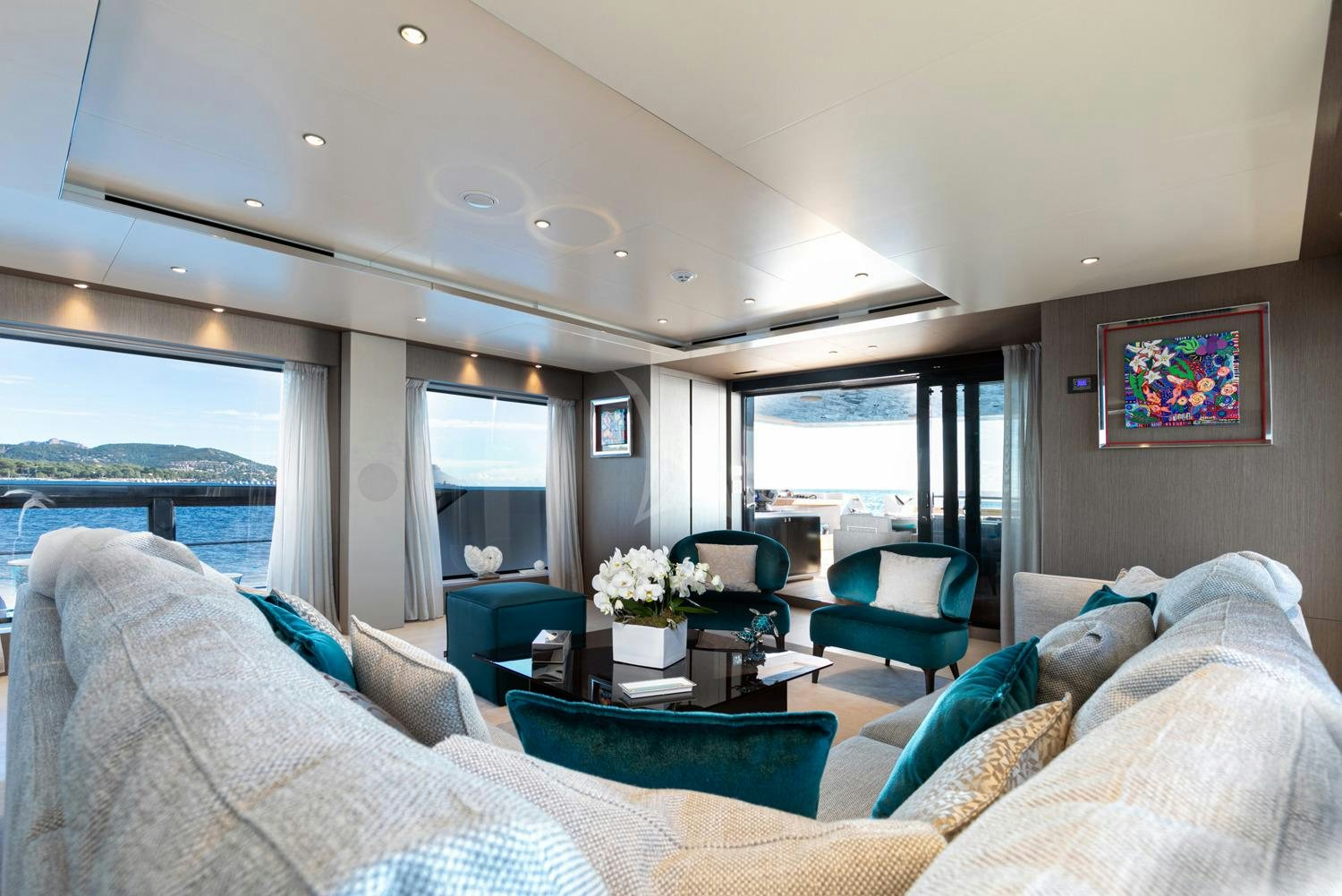 a living room with a large window aboard JAG'B Yacht for Charter