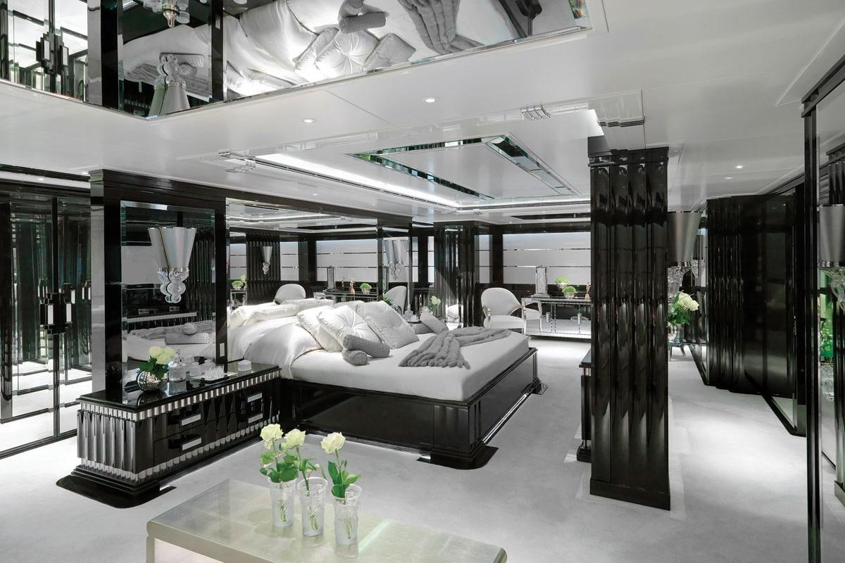 a room with a bed and a table aboard SILVER ANGEL Yacht for Charter