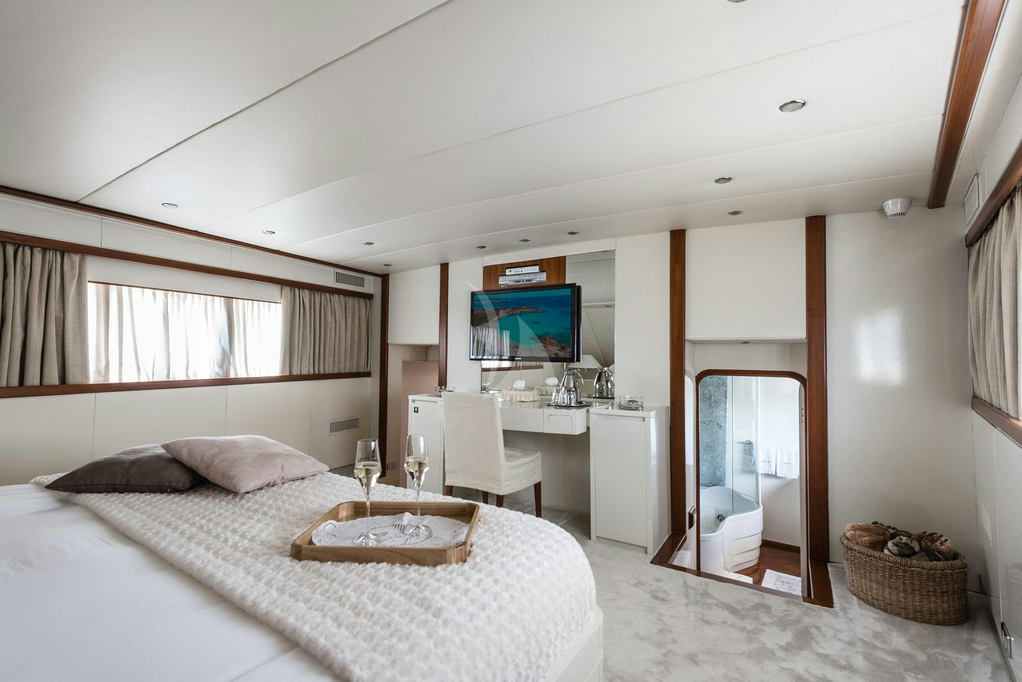 a bedroom with a large bed aboard SOUTH PAW C Yacht for Charter
