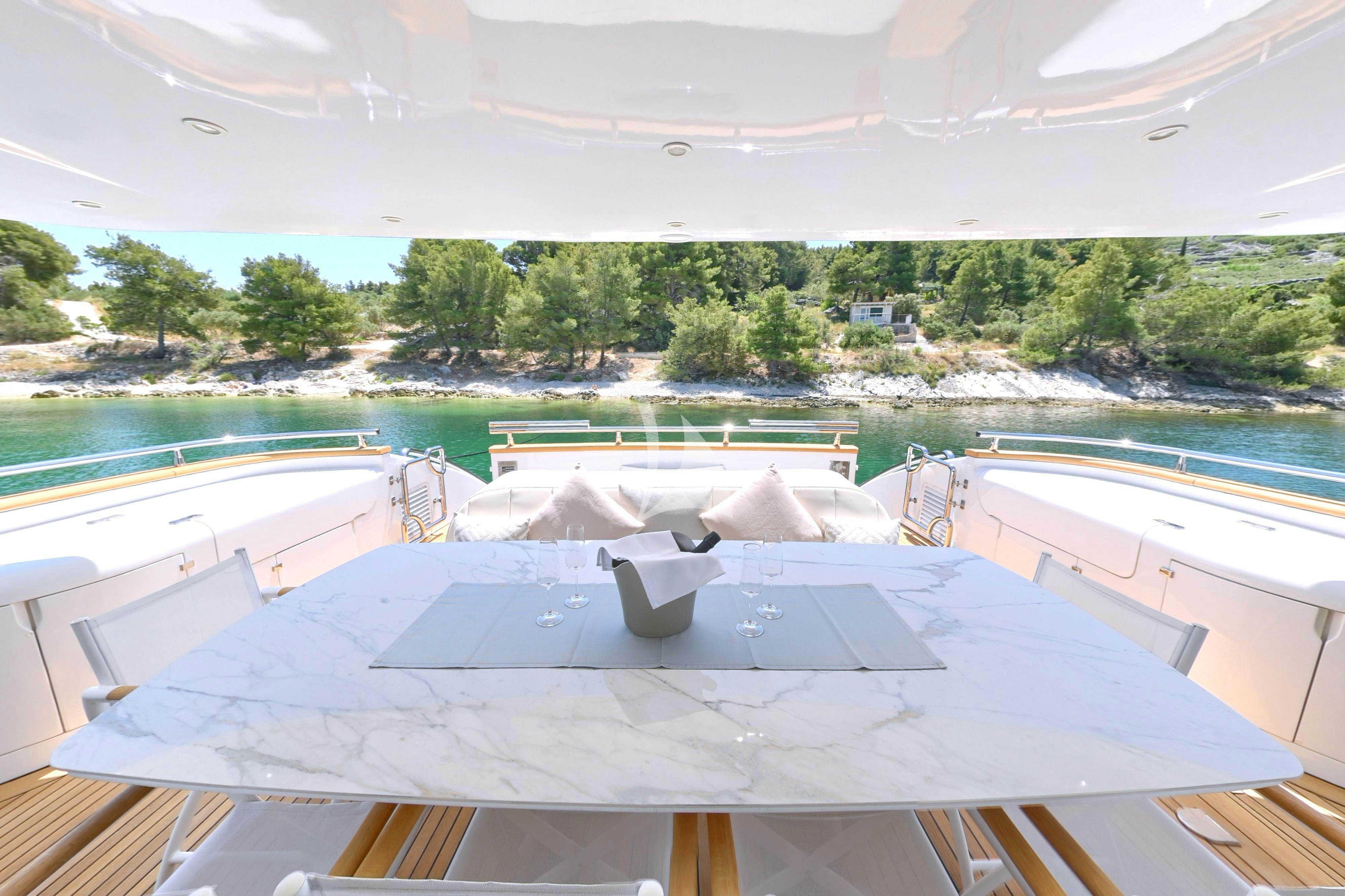 a pool with a large building in the background aboard TUSCAN SUN Yacht for Charter