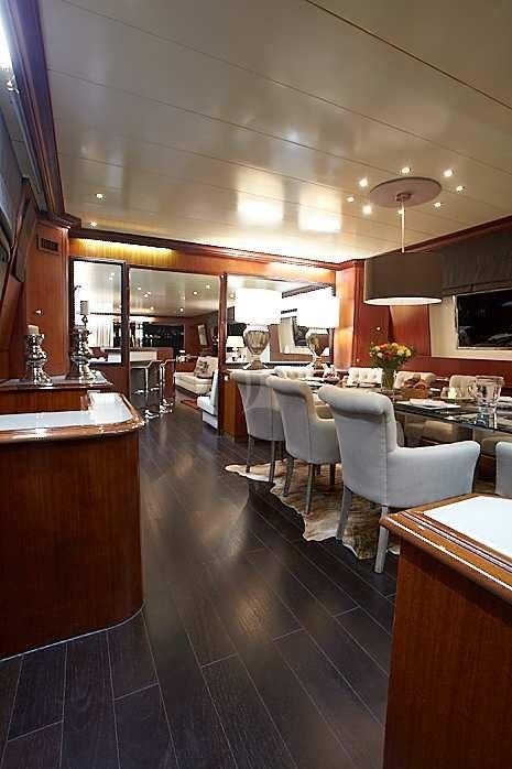 a large room with tables and chairs aboard QUEEN SOUTH Yacht for Charter