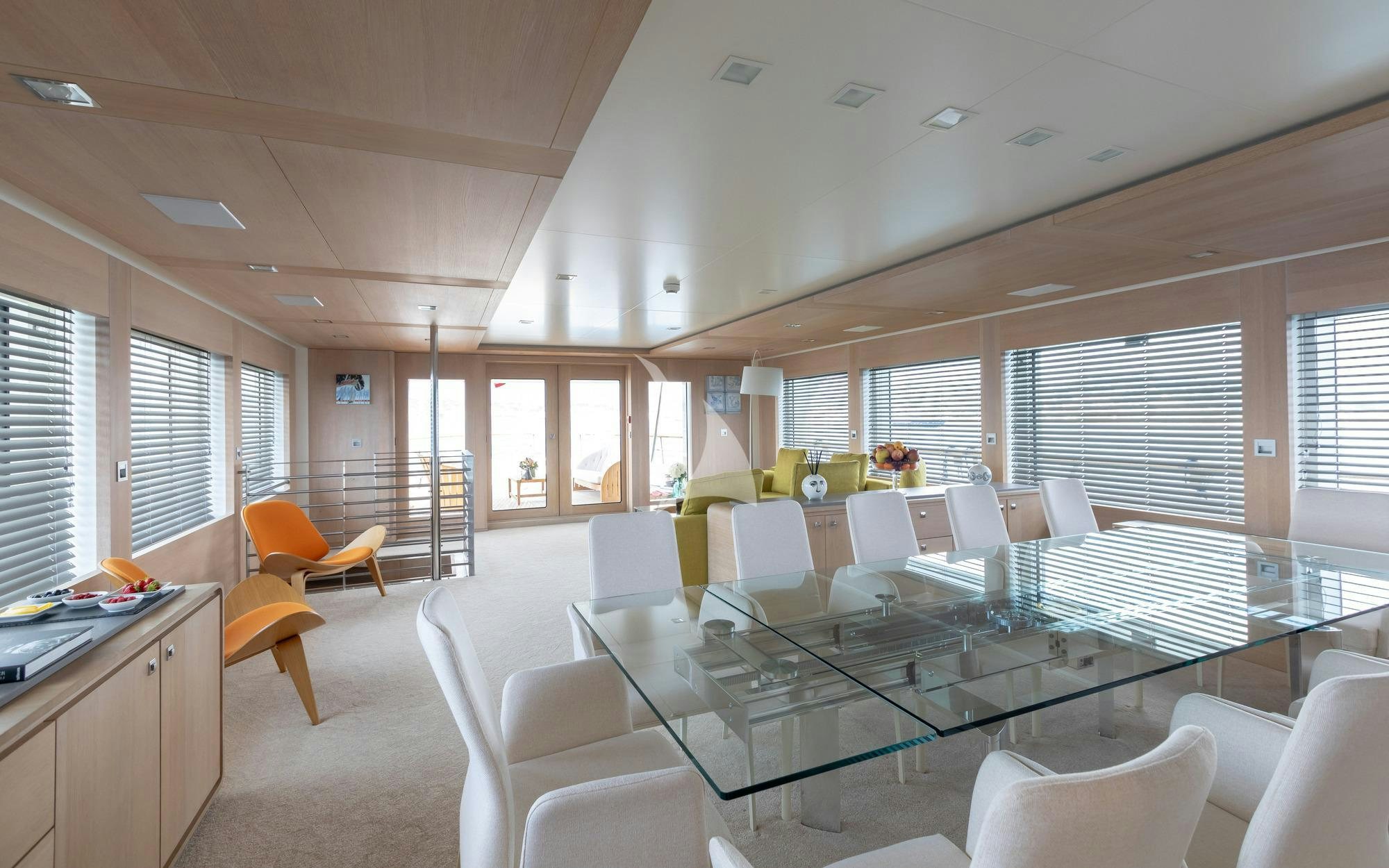 a room with a table chairs and a window aboard ROBBIE BOBBY Yacht for Charter