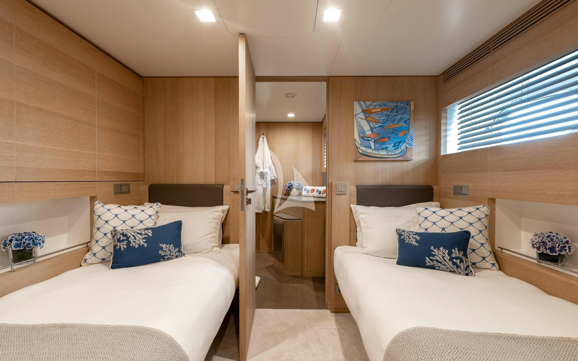 a room with a bed and a window aboard ROBBIE BOBBY Yacht for Charter