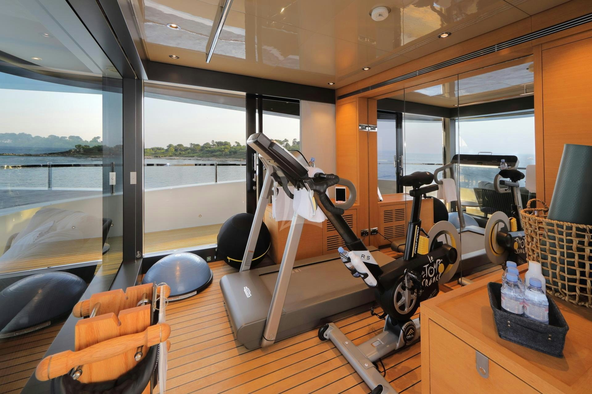 a room with exercise equipment aboard X Yacht for Charter