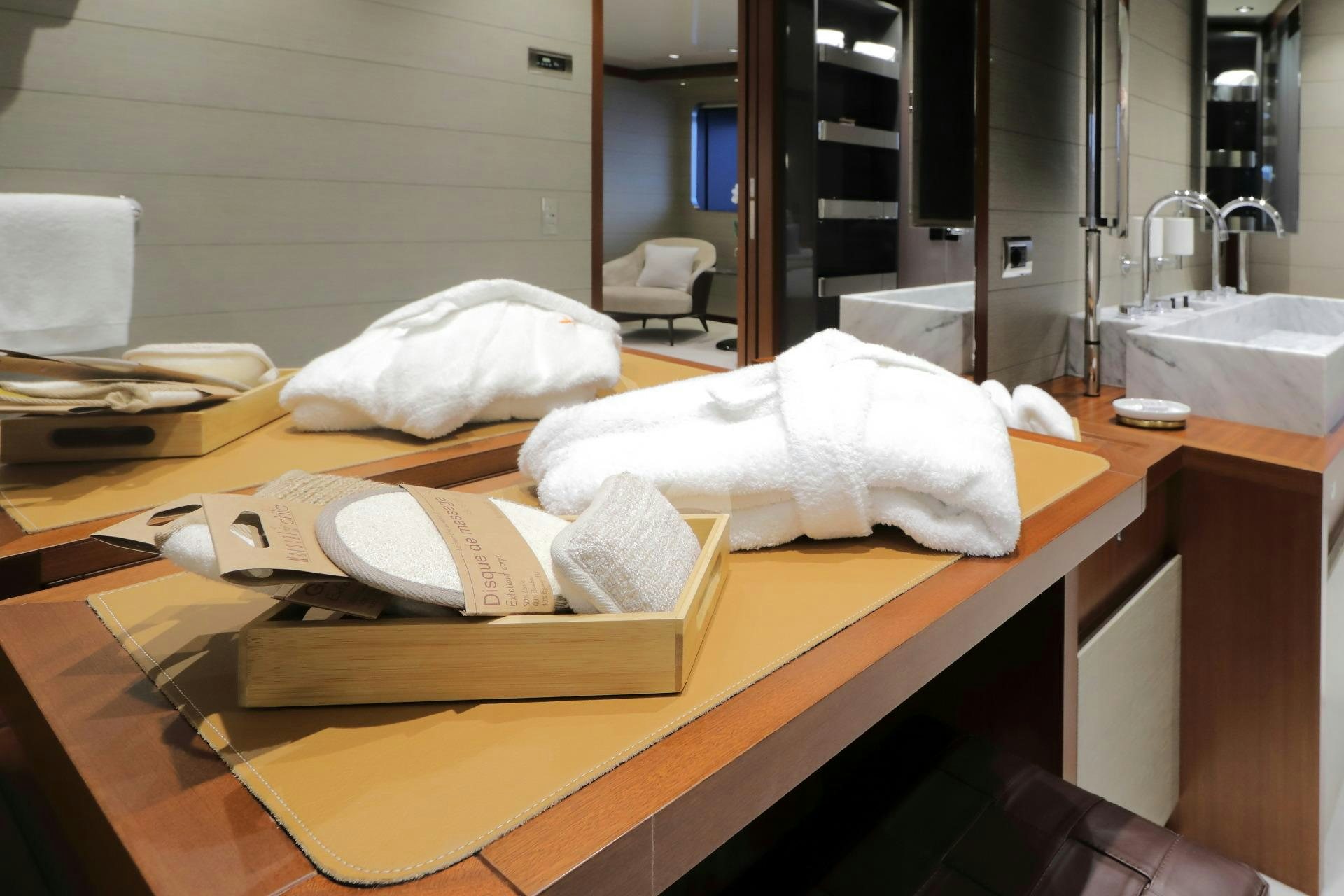 a couple of white towels on a counter aboard X Yacht for Charter