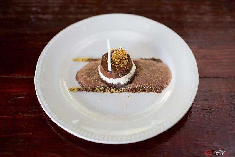 a plate with a slice of cake on it aboard SHENANDOAH OF SARK Yacht for Charter