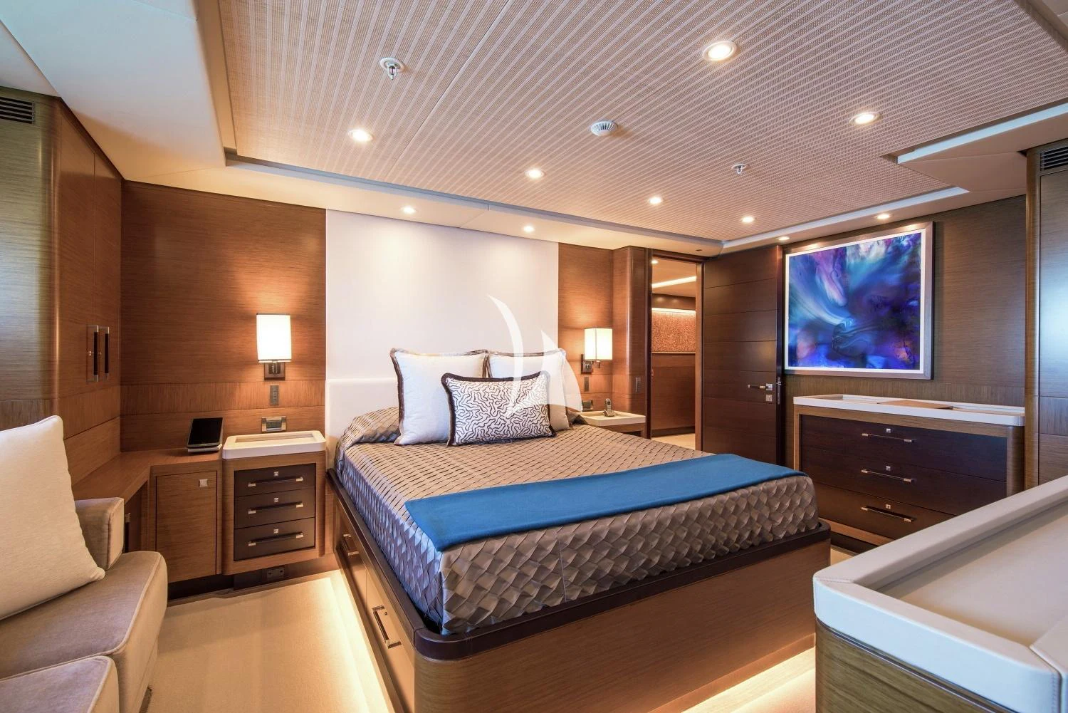 a bedroom with a bed and a television aboard KOKOMO Yacht for Charter
