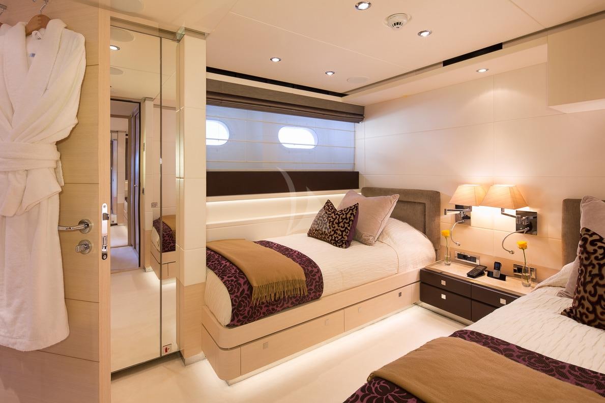 a hotel room with a bed and a large window aboard LADY L Yacht for Sale