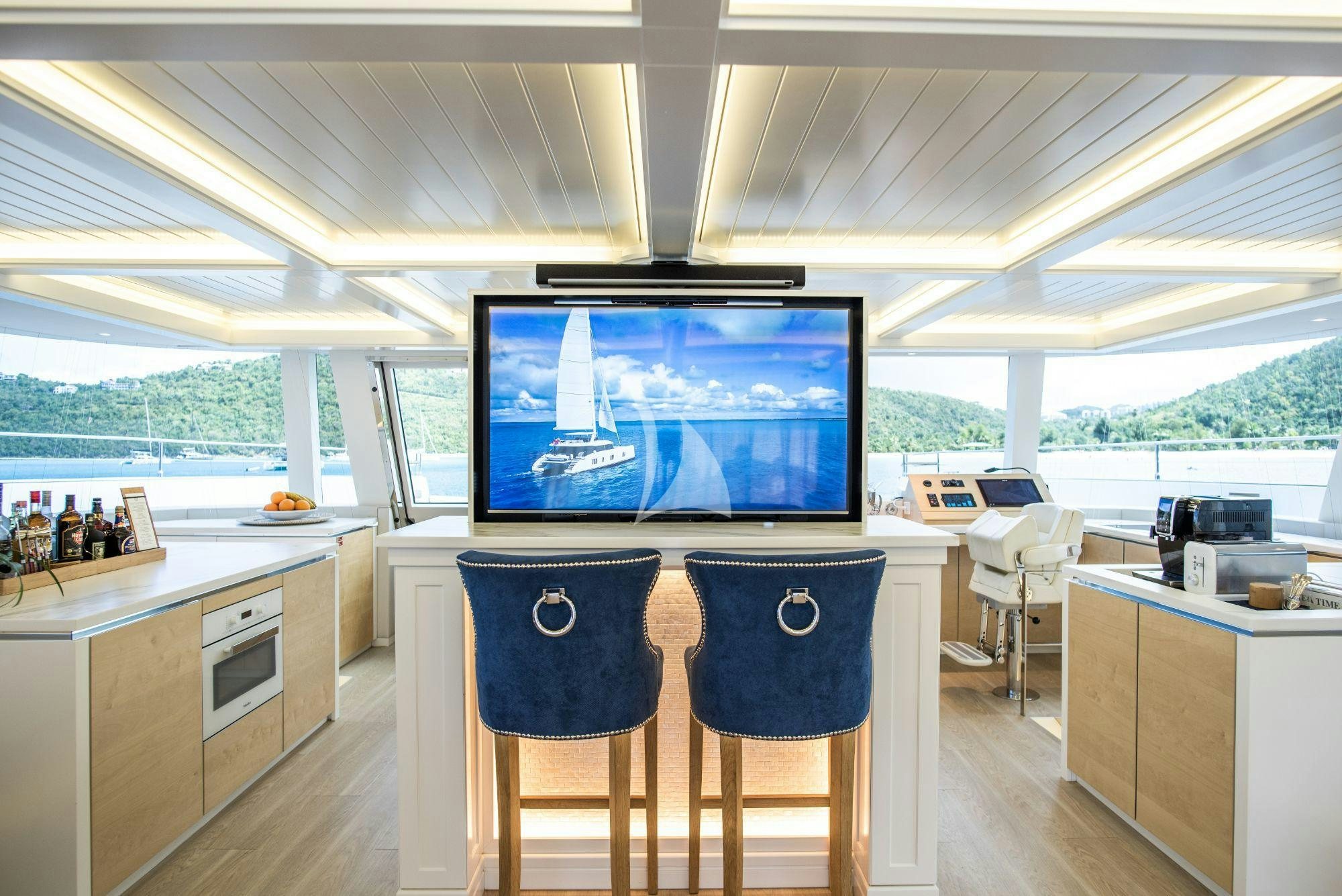 a room with a table and chairs aboard BUNDALONG Yacht for Charter