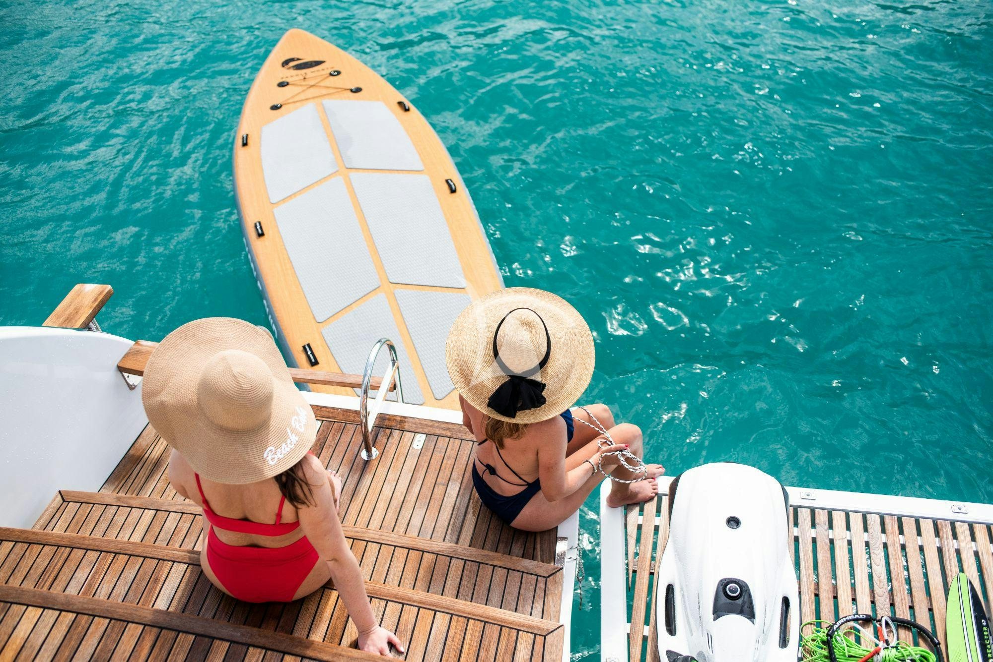 a couple of people in a boat aboard BUNDALONG Yacht for Charter