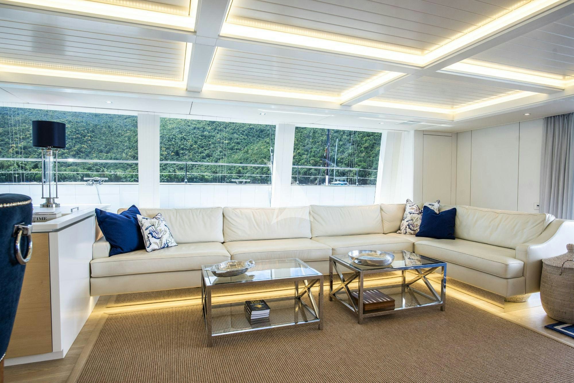a living room with a white couch aboard BUNDALONG Yacht for Charter