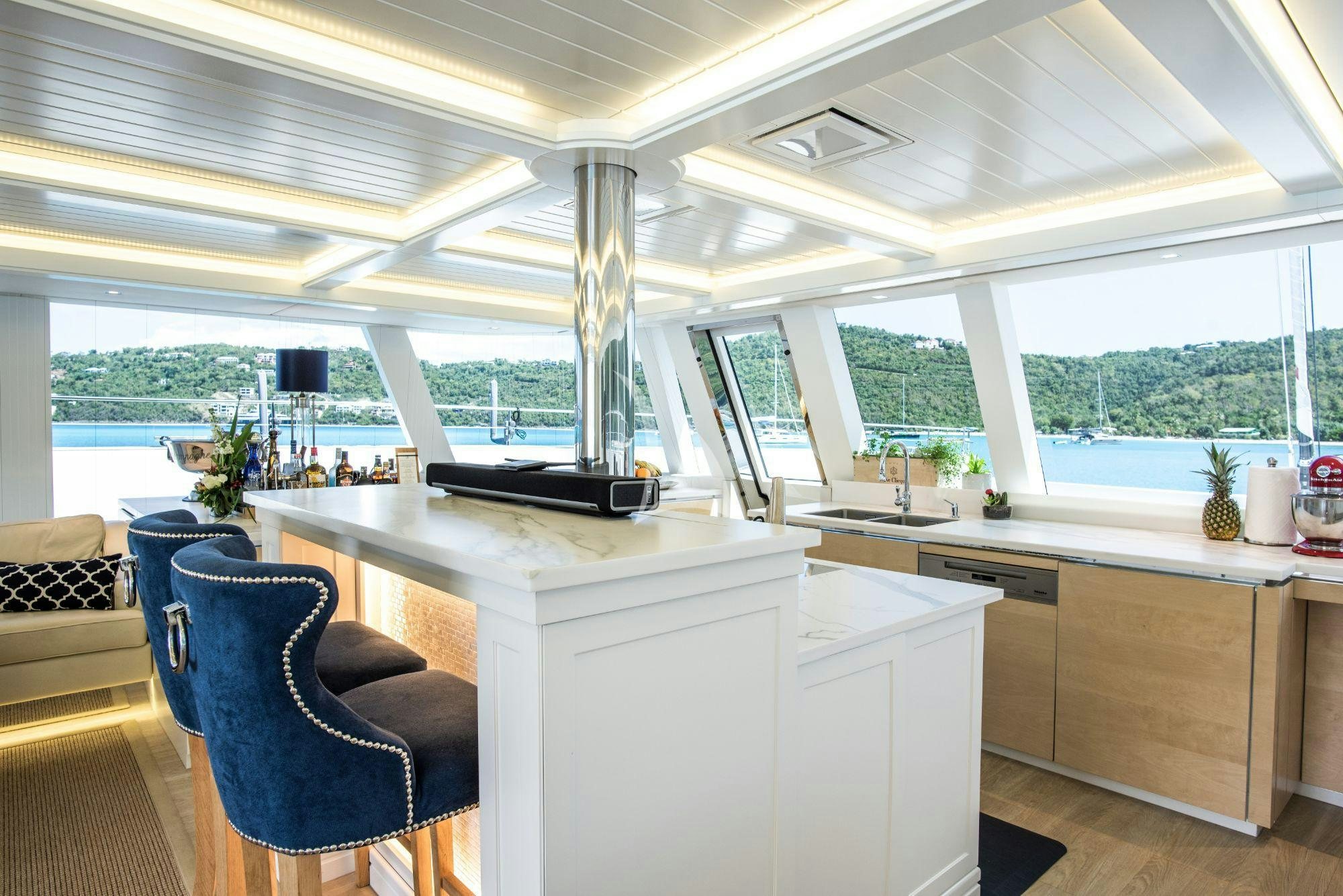 a kitchen with a large window aboard BUNDALONG Yacht for Charter