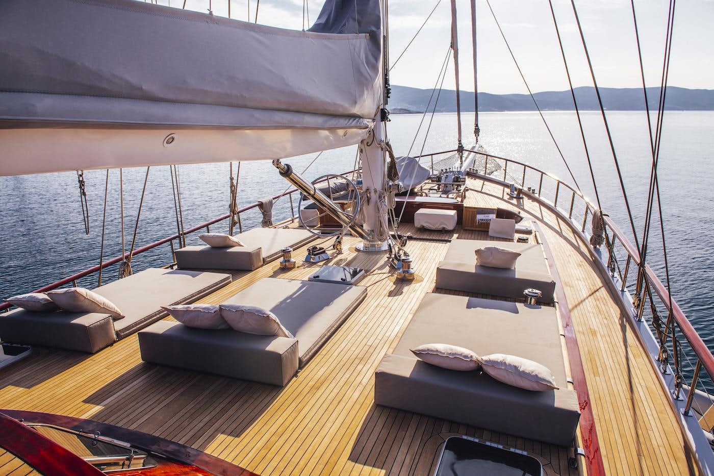 a deck with a boat on it aboard HIC SALTA Yacht for Charter