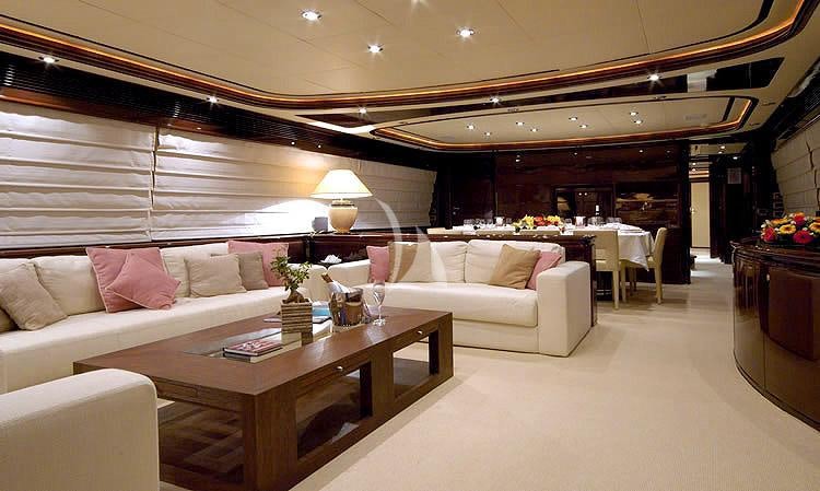 a living room with a couch and a table aboard TWO KAY Yacht for Charter