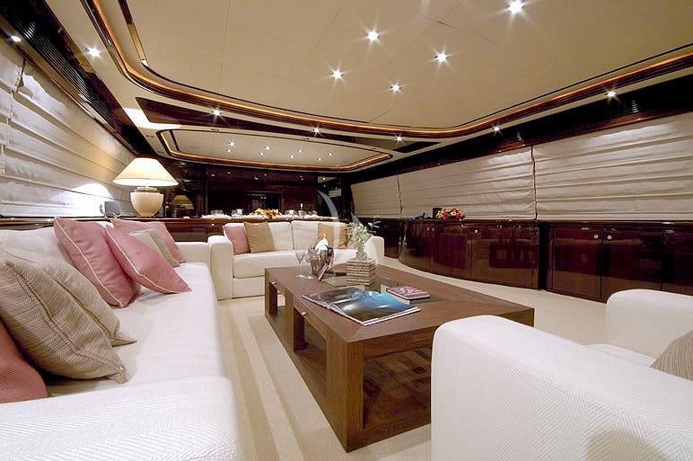 a room with a couch and a coffee table aboard TWO KAY Yacht for Charter