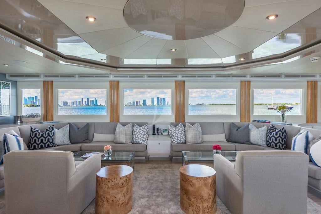 a living room with a large sofa aboard SURINA Yacht for Charter