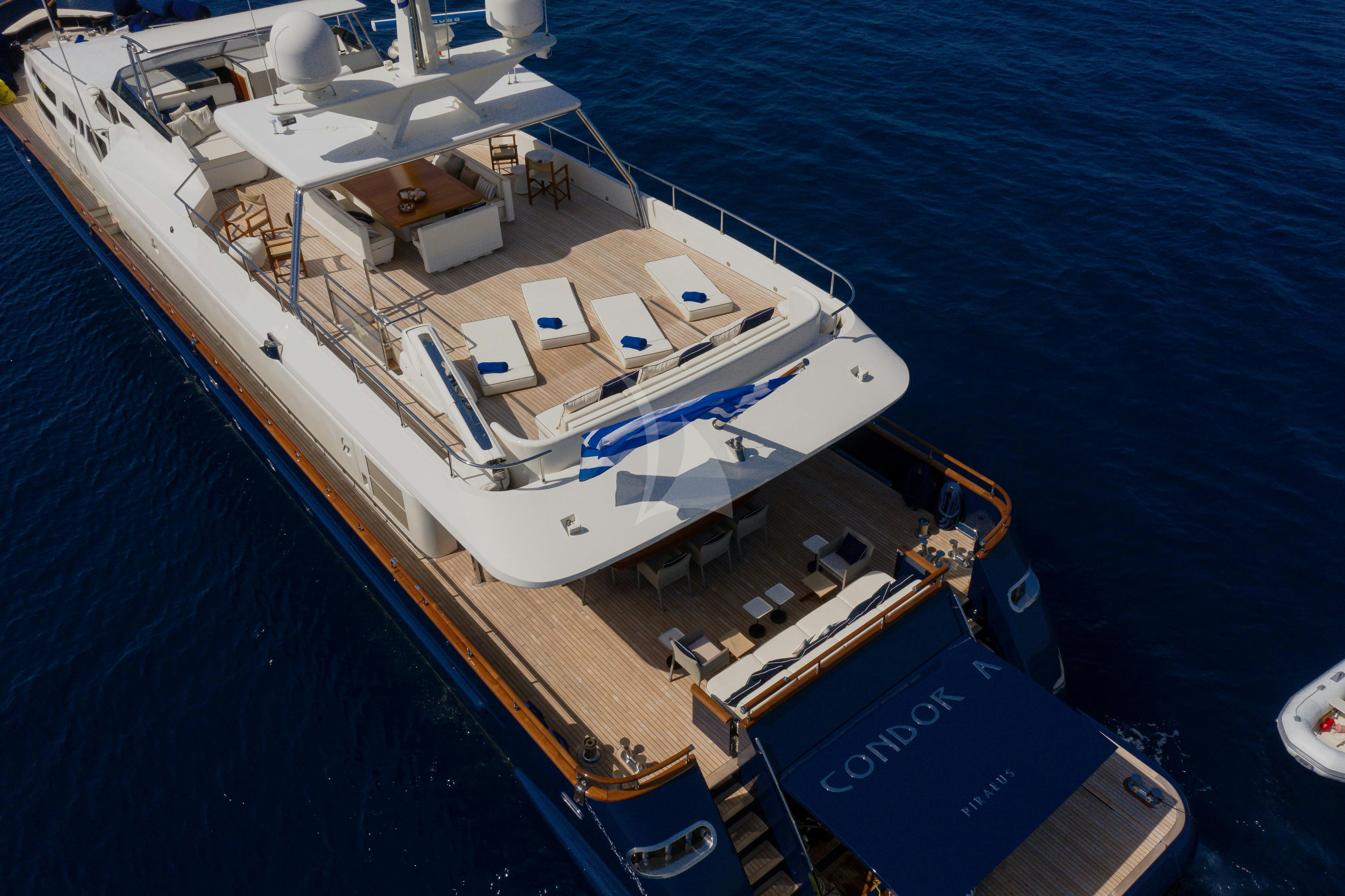 a large white boat on the water aboard CONDOR A Yacht for Charter