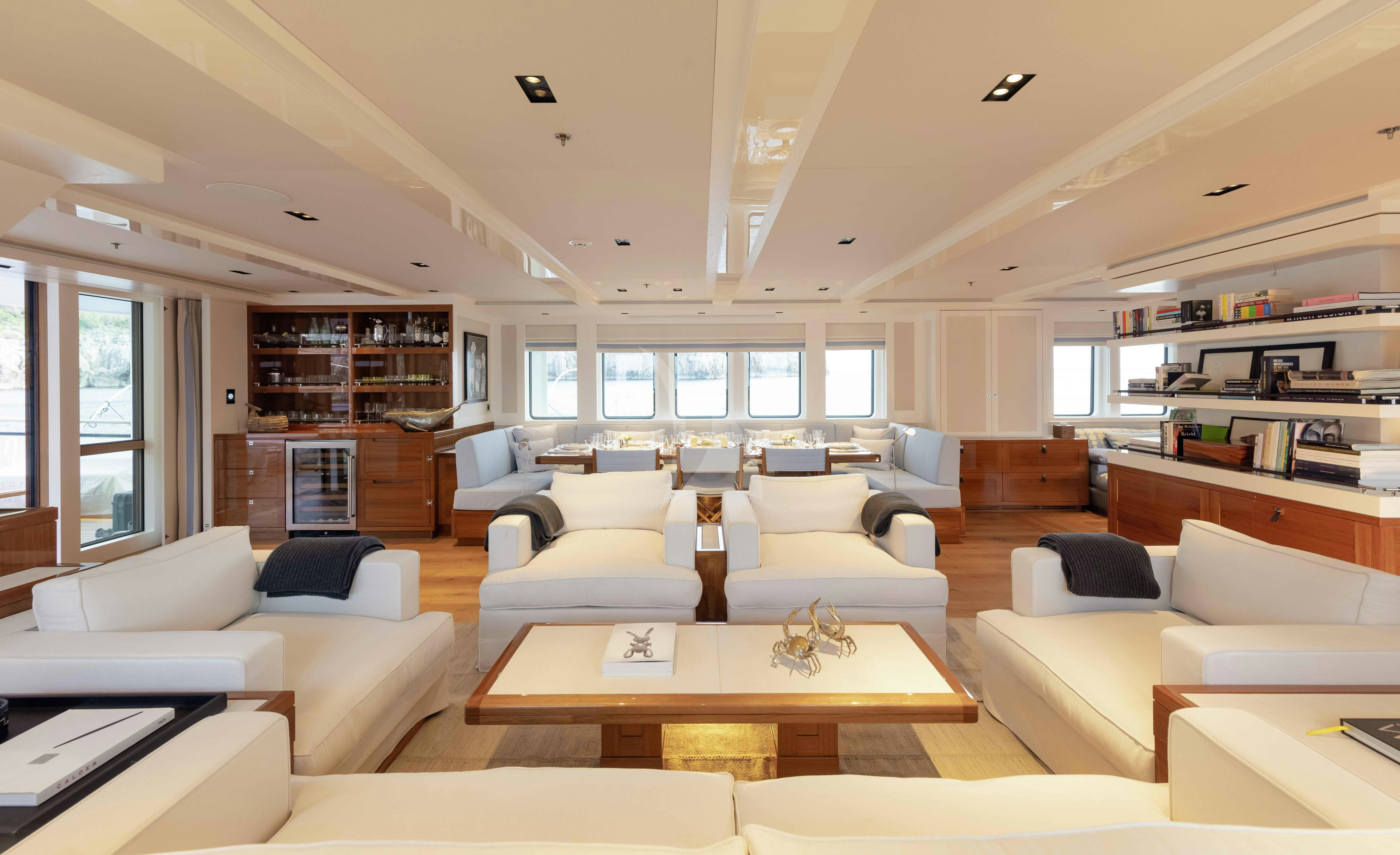 a living room with a large window aboard BLUE II Yacht for Charter