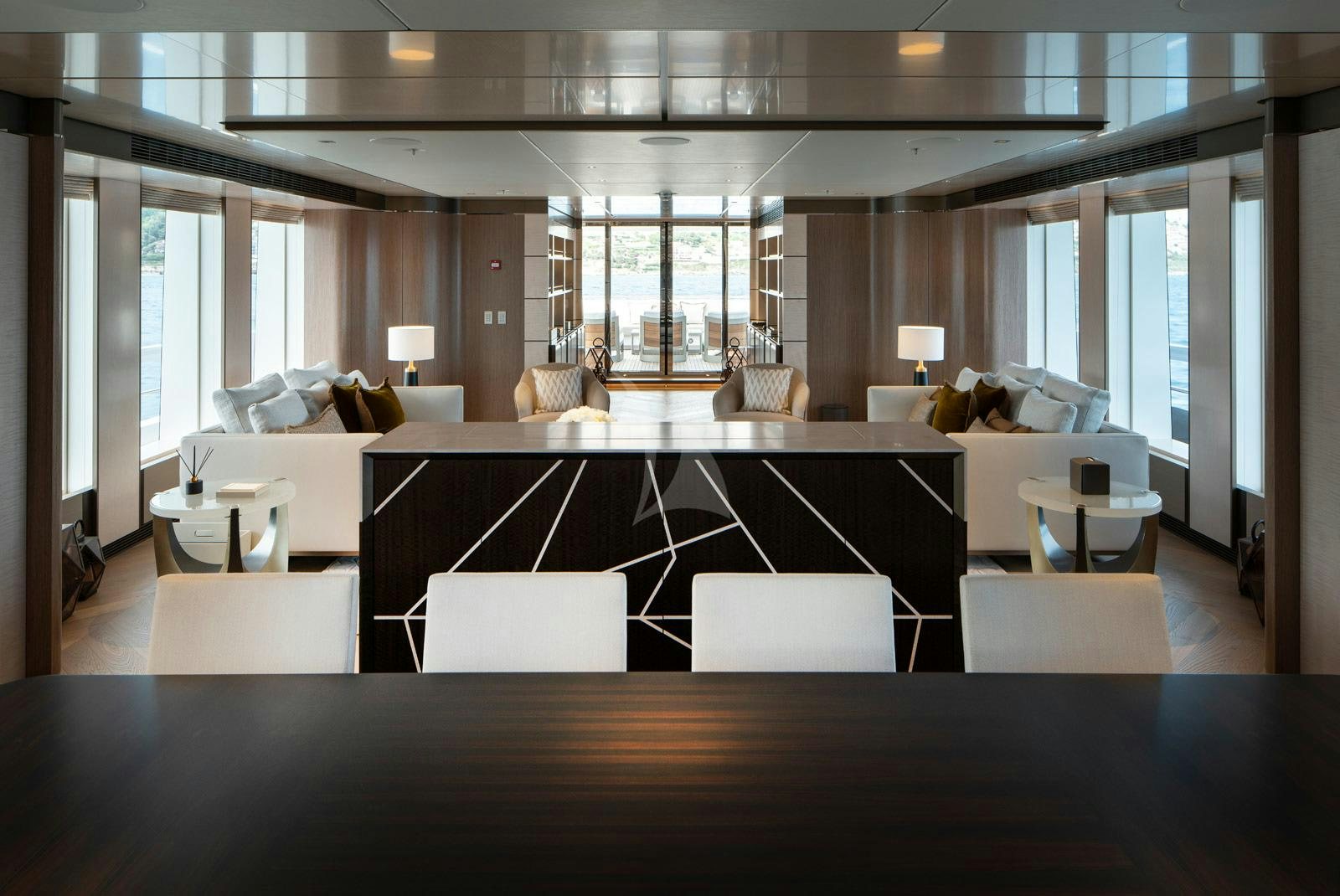 a large room with a couch and a table aboard MOSKITO Yacht for Charter